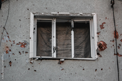 Irpin, Kyiv Oblast,  Ukraine - 23.05.2022: Cities of Ukraine after the Russian occupation. destroyed civilian building in  city of Irpin, northwest of Kyiv. Window close up