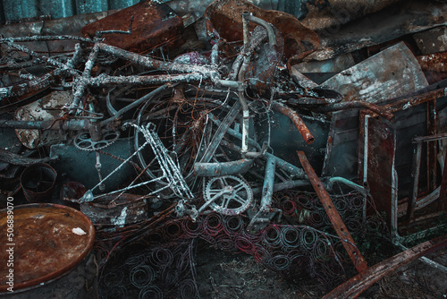 Irpin, Kyiv Oblast,  Ukraine - 23.05.2022: Cities of Ukraine after the Russian occupation. destroyed and burnt civilian bike in  city of Irpin, northwest of Kyiv. Close up