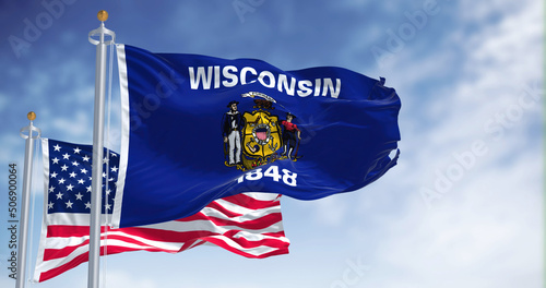 Schilderij op canvas The Wisconsin state flag waving along with the national flag of the United State