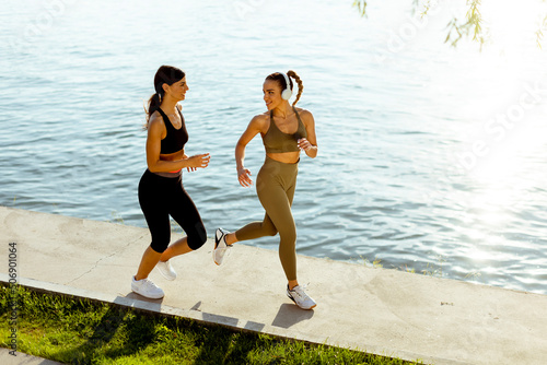 Young woman taking running ...