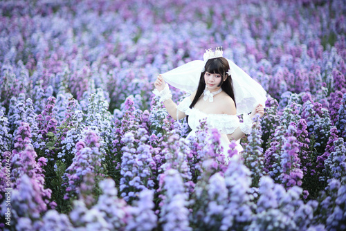 Photography Beautiful young woman with white lolita dress with european garden Japanese fash