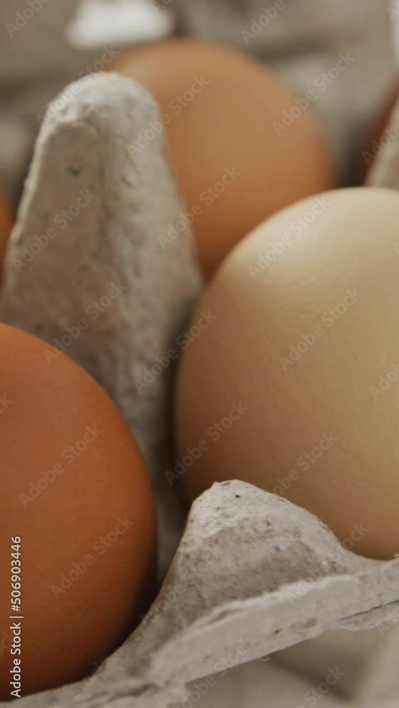 Video of close up of brown eggs in egg carton on rustic background Video of close up of brown eggs in egg carton on rustic background