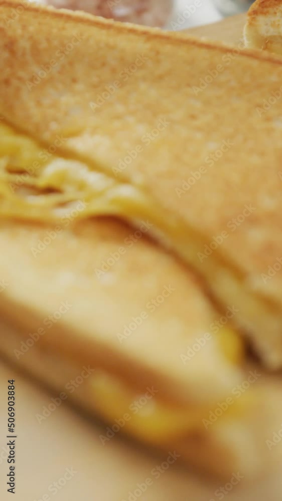 Video of close up of freshly prepared cheese white bread sandwich on wooden board Video of close up of freshly prepared cheese white bread sandwich on wooden board
