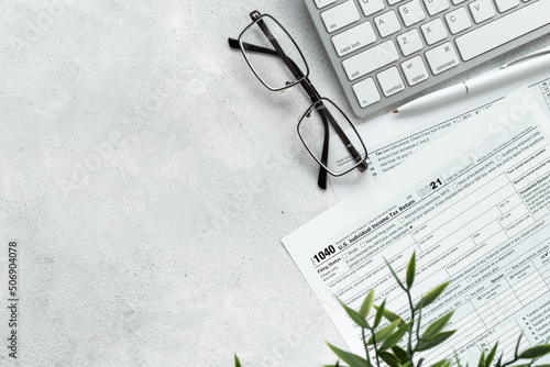 US tax form on office table desktop. Accountant culculate taxes