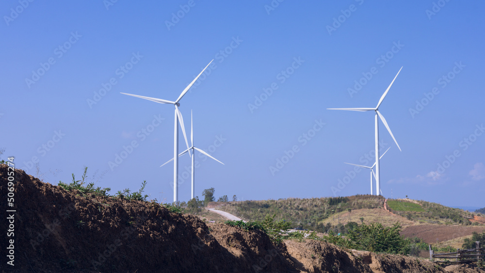 Offshore wind power and energy farm with many wind turbines on the mountain Offshore wind power and energy farm with many wind turbines on the mountain