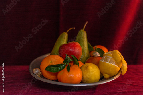 Fototapeta Naklejka Na Ścianę i Meble -  Fruit on a Silver Plate with Candle