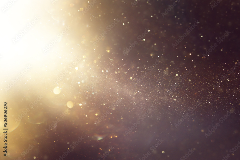 background of abstract glitter lights. gold and black. de focused background of abstract glitter lights. gold and black. de focused