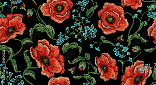 Embroidery floral seamless pattern with red poppies, forget-me-nots and bees.