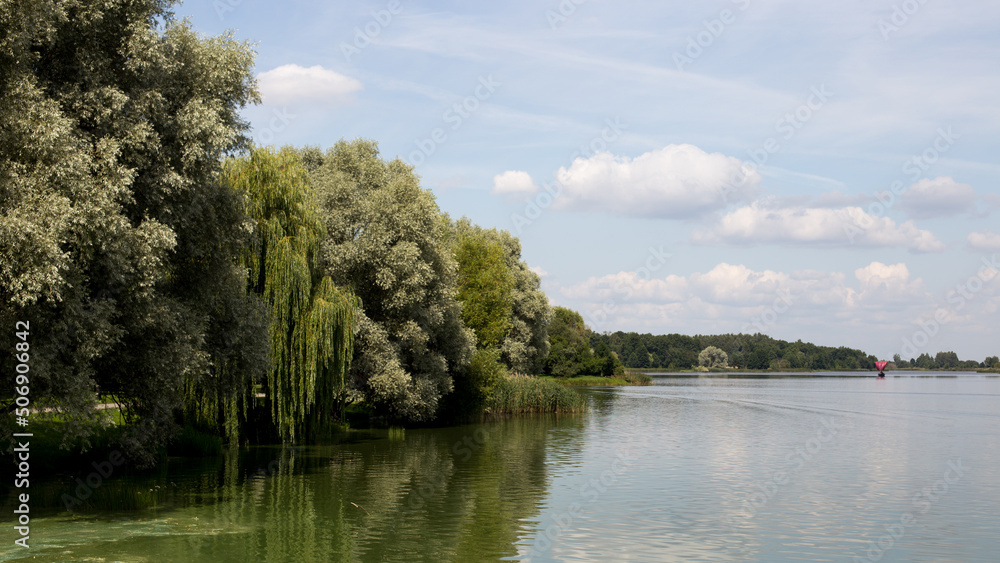 Lake shore, water surface of calm wate Lake shore, water surface of calm wate