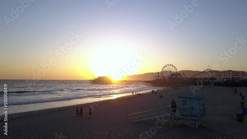 Lifeguard tower at summer day sunset
Gorgeous aerial view flight rising up drone footage
at LA Santa Monica Pier California USA 2018. Cinematic view from above Tourist Guide by Philipp Marnitz