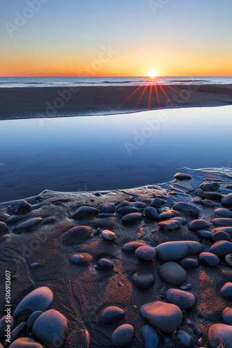 Sunrise on the coast of the...