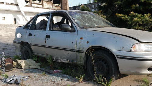 car damaged by fragments as a result of military operations