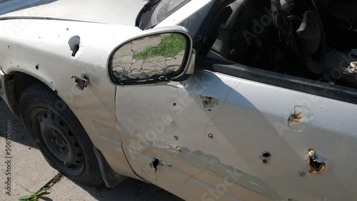 car damaged by fragments as a result of military operations