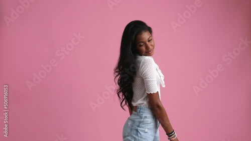 The beautiful 20-year-old black woman waved her beautiful, curly hair.