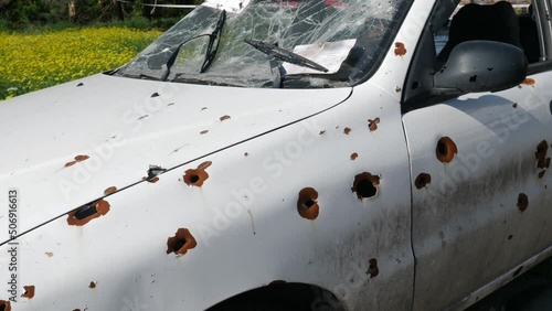 car damaged by fragments as a result of military operations