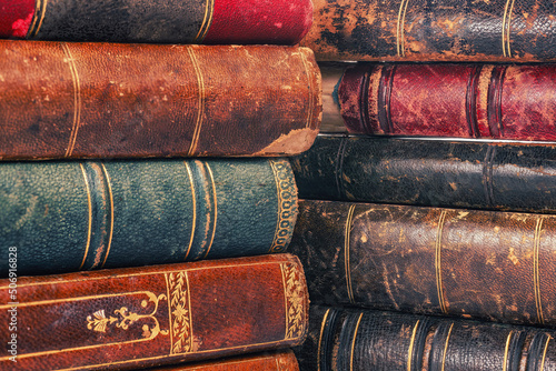 Old books pile covers close up