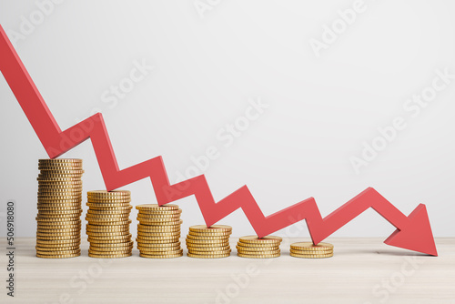 Bild auf Leinwand Inflation and global economy crisis concept with red arrow going down on golden coin stacks