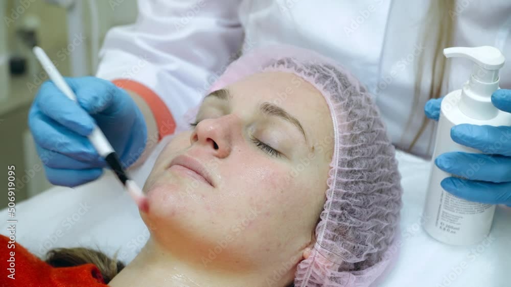Beauty clinic concept. Young woman getting professional facial procedure. Beauty clinic concept. Young woman getting professional facial procedure.