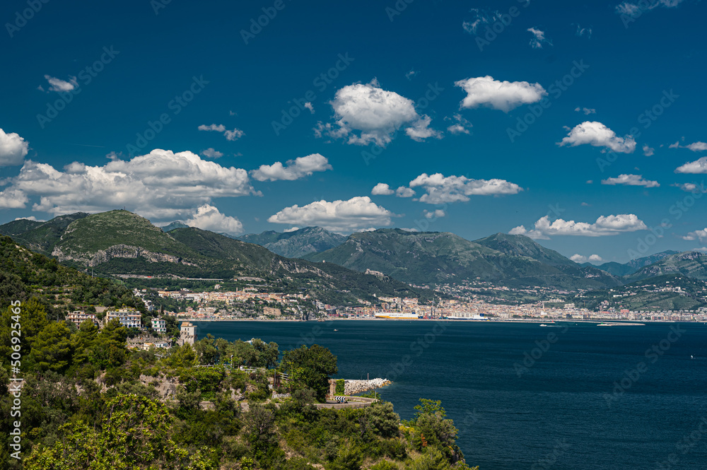 Seascape on the Amalfi Coast, Province of Salerno, Campania. Mountains, sea and blue sky with clouds. Southern Italy.