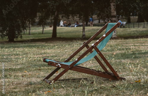 Folding chair in park. England. London. Hyde Park in the eighties.