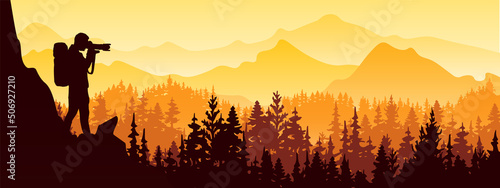 Photographer stands on top of rock take picture of landscape. Mountains and forest in background. Orange and yellow silhouette illustration. 