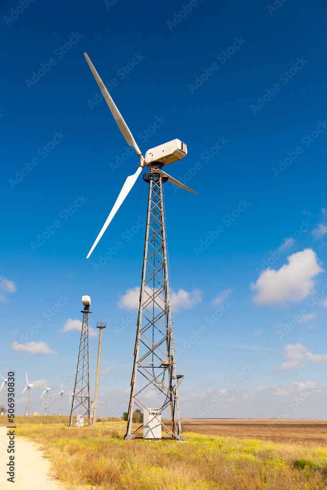 Windmills, summer rural landscape