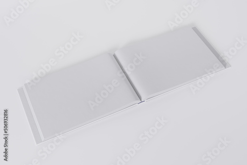 Mockup of a rectangular open book with a blank, glossy, white cover on white background. Isolated with clipping path.	
