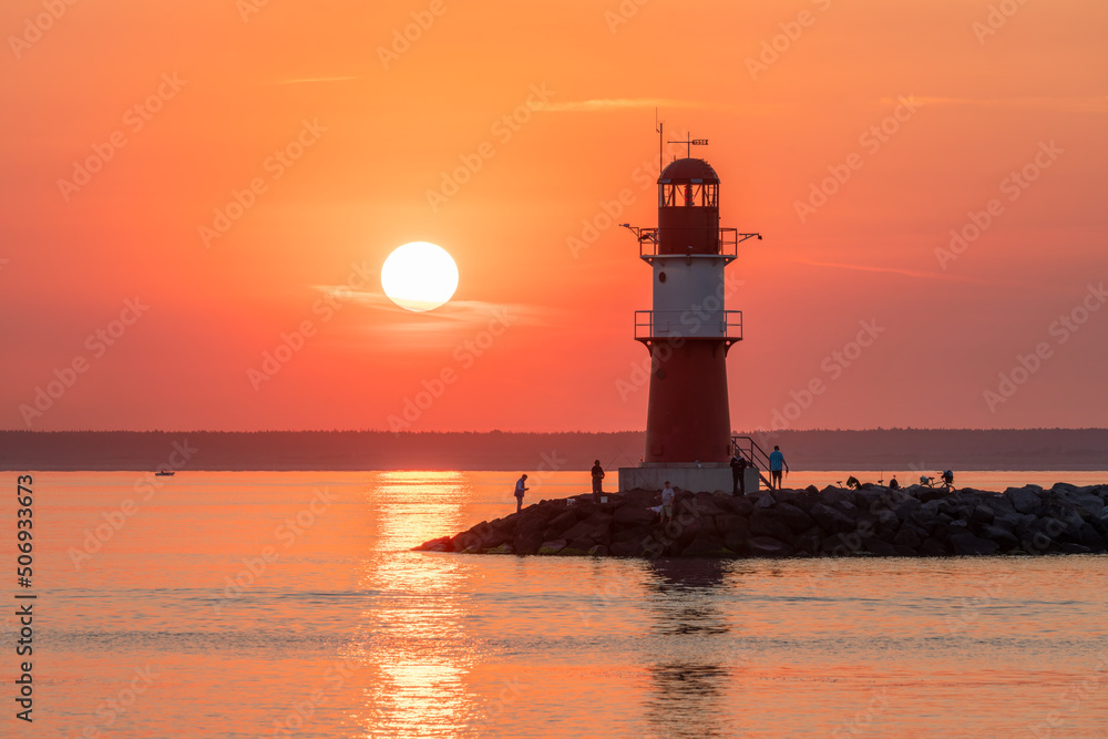 Sunrise at the Lighthouse Ostmole Warnemünde, Warnemünde, Rostock, Mecklenburg-Vorpommern, Germany Sunrise at the Lighthouse Ostmole Warnemünde, Warnemünde, Rostock, Mecklenburg-Vorpommern, Germany