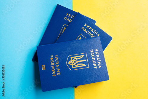 Passports of a citizen of Ukraine on a blue and yellow background. Inscription in ukrainian Ukraine passport