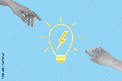Hands reaching for glowing light bulb. Brainstorm, teamwork, collaboration, finding and generating solution or good idea concept on blue background. High quality photo