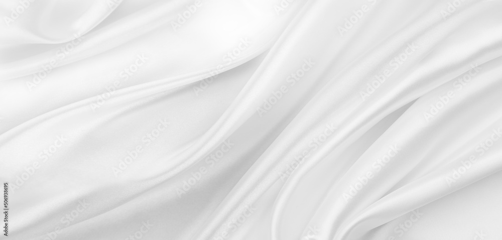 Close-up of rippled white silk fabric texture background