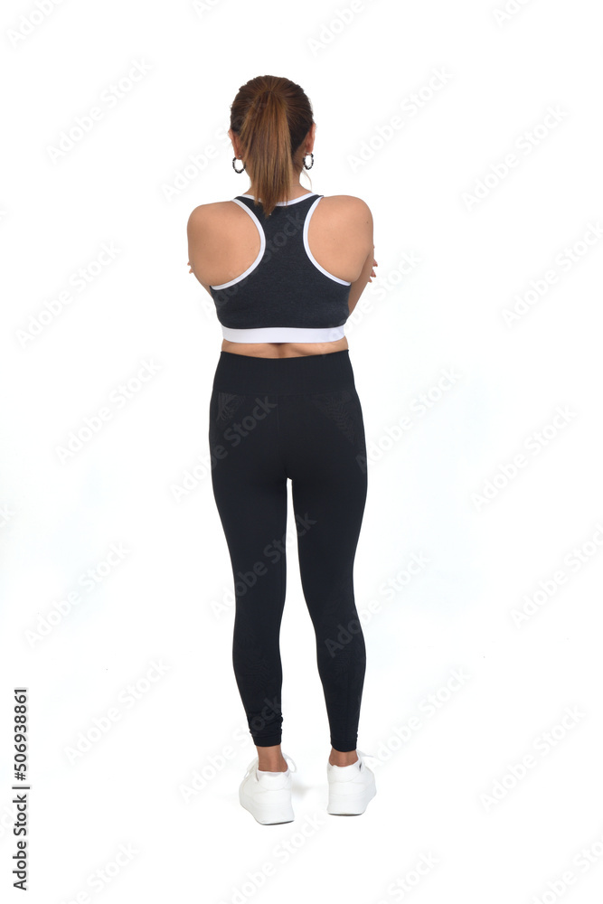 custom made wallpaper toronto digitalback view of a woman with sportswear and sneaker arms crossed on white background