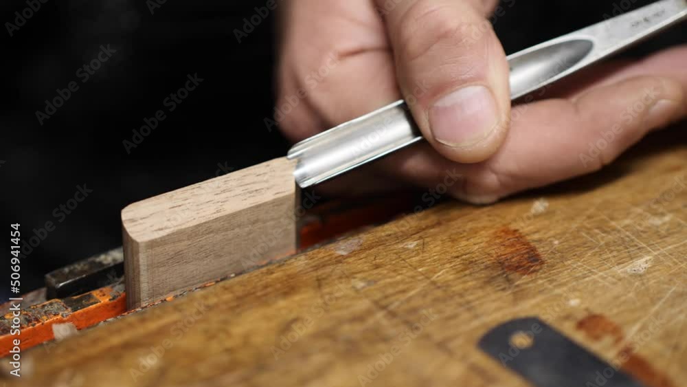 carpenter in the workshop makes furniture with a hand tool carpenter in the workshop makes furniture with a hand tool