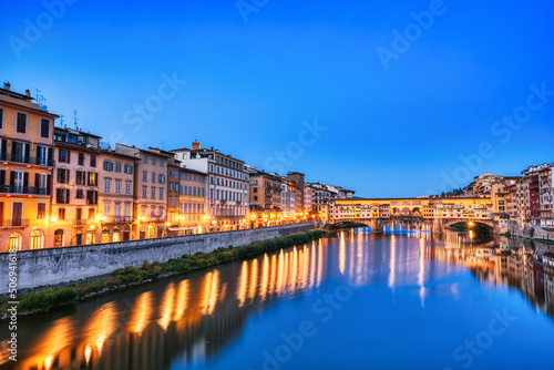 Illuminated Ponte Vecchio Bridge with Reflection in Arno River at Dusk  Florence
