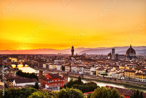 Fototapeta Naklejka Na Ścianę i Meble -  Florence Aerial View at Golden Sunset over Ponte Vecchio Bridge, Palazzo Vecchio and Cathedral of Santa Maria del Fiore with Duomo