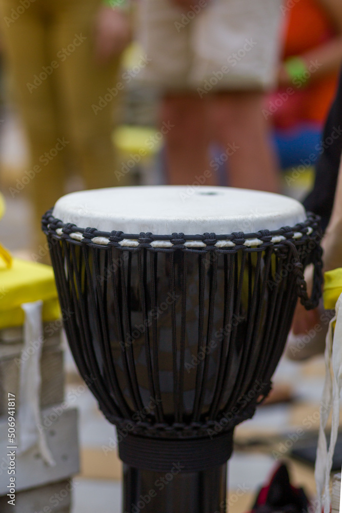 Fototapeta premium White bongo drum with black fabric wrap. Yoga Festival.