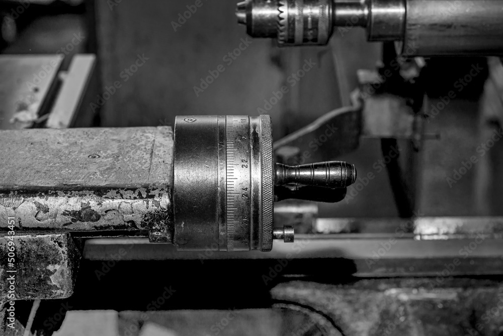  Metalworking workshop, metal processing machines.  Vintage Industrial Machinery in a old factory - black and white photo