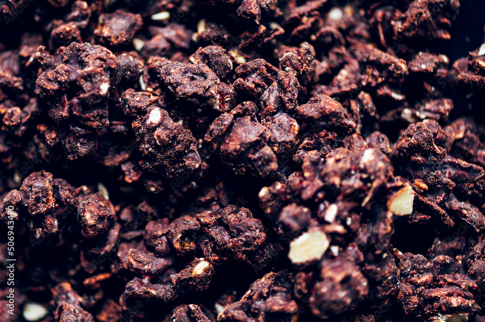 Obraz premium Organic Dark Chocolate Keto Nuggets, crunchy nuts and seeds, including pecans, almonds and hemp seeds coved in premium belgian dark chocolate, providing healthy snack. Gluten Free, Vegan Friendly