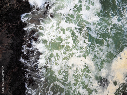 Aerial view of foamy white water surface. Storm in the sea. Bubbling water. Minimalism. Abstraction. There are no people in the photo. Element. The beauty and majesty of nature.