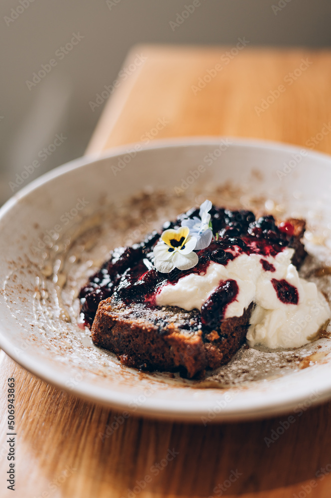 Sweet toast from homemade banana bread, non dairy yogurt and fresh berries compote Sweet toast from homemade banana bread, non dairy yogurt and fresh berries compote