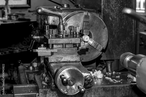  Metalworking workshop, metal processing machines. Vintage Industrial Machinery in a old factory - black and white photo
