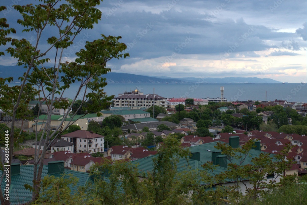 Rain clouds gather over the city. Before a thunderstorm.View of the city from the height of the mountains. Black Sea. Myskhako. Novorossiysk. Russia. Rain clouds gather over the city. Before a thunderstorm.View of the city from the height of the mountains. Black Sea. Myskhako. Novorossiysk. Russia.