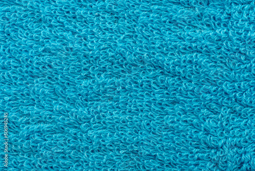 The texture of the blue towel close-up. Material. Textile