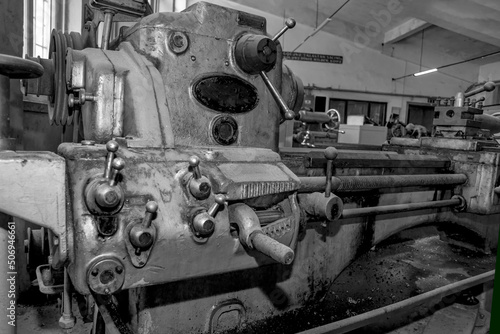  Metalworking workshop  metal processing machines.  Vintage Industrial Machinery in a old factory - black and white photo