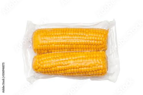 Studio shot of sweet corn packed with plastic vacuum package on white background. Packed healthy vegetarian food concept.