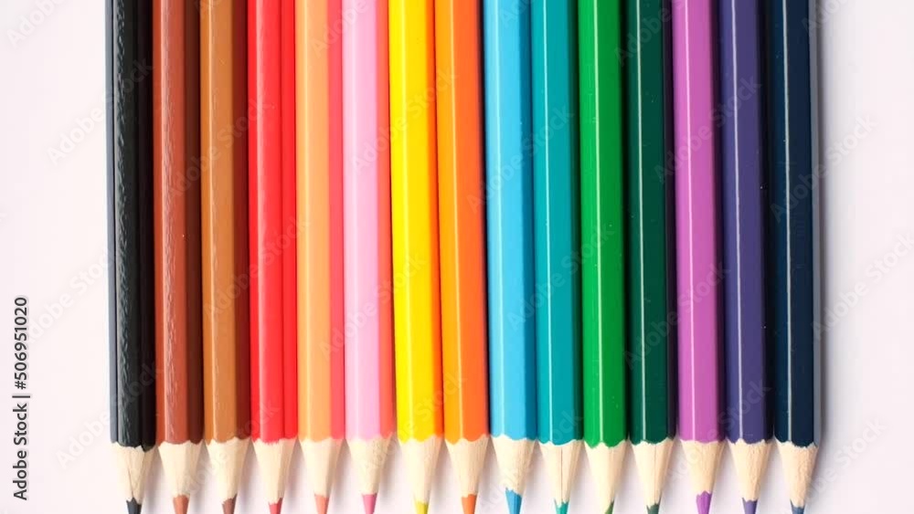 A set of colored pencils isolated on a white background in banner format. Place for text A set of colored pencils isolated on a white background in banner format. Place for text