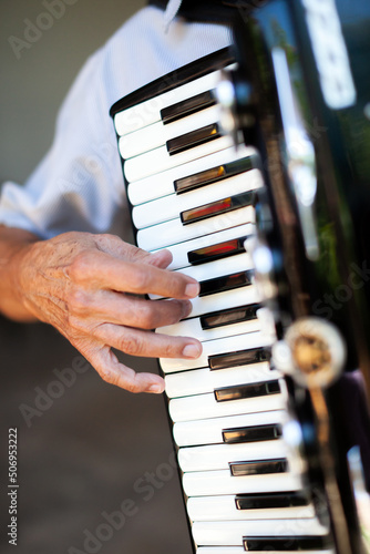 Accordionist hand playing the accordion