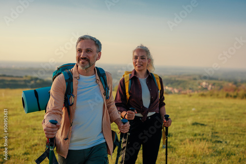 Smiling middle age couple hiking together