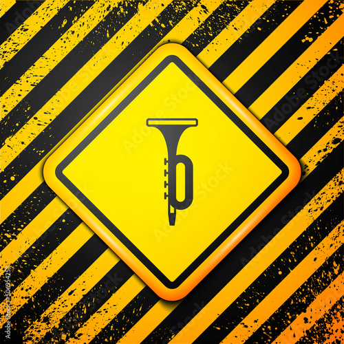 Black Trumpet icon isolated on yellow background. Musical instrument. Warning sign. Vector