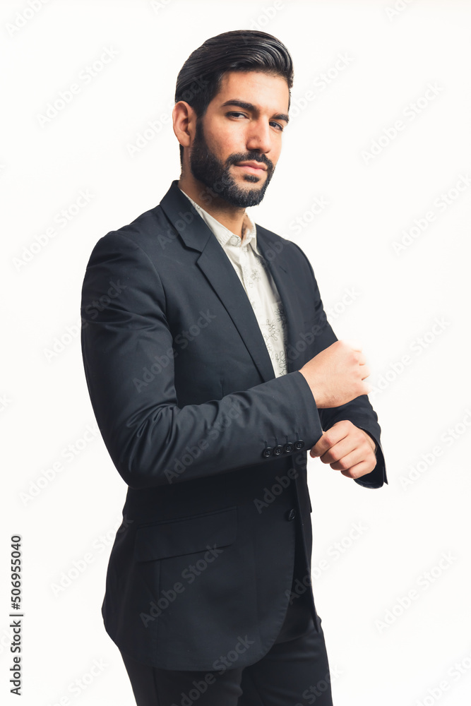 young man wearing a suit fastering a button, isolated white background, vertical. High quality photo young man wearing a suit fastering a button, isolated white background, vertical. High quality photo